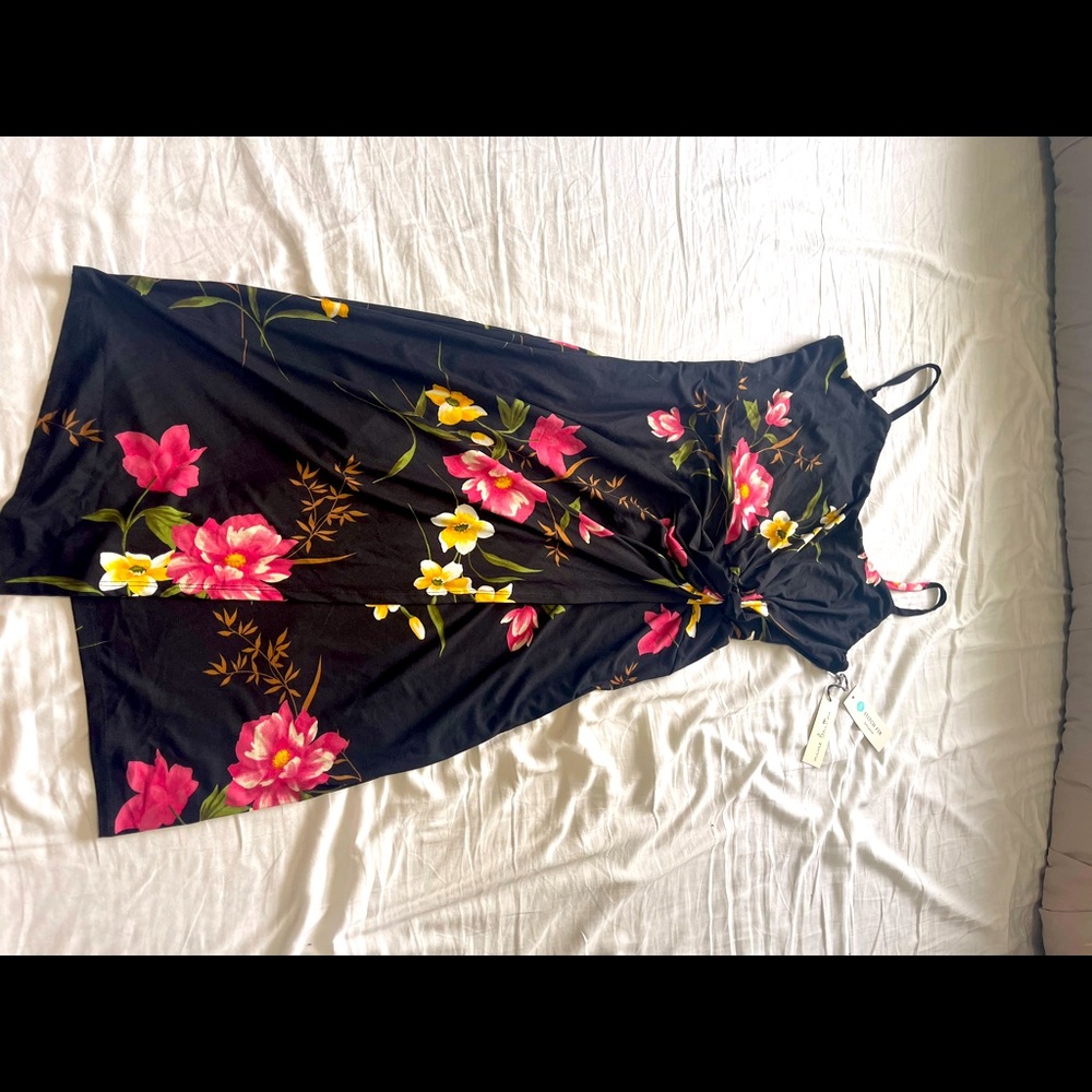 Never worn, floral, below the knee, asymmetrical faux wrap dress with tags.